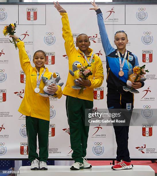 Rodriguez De Andrade of Brazil , Flavia Lopes Saraiva of Brazil and Agustina Santamarina pose for a picture in the podium of Women's Individual...