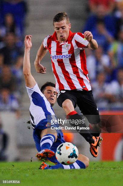 Iker Muniain of Athletic Club duels for the ball with Luis Pizzi of RCD Espanyol during the La Liga match between RCD Espanyol and Athletic Club at...