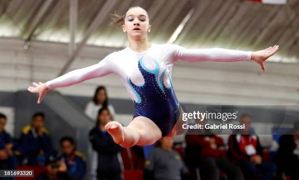 Agustina Santamaria of Argentina competes in the Floor event during the Women's Team all-around as part of the I ODESUR South American Youth Games at...