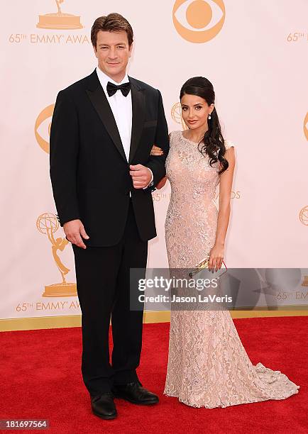 Actor Nathan Fillion and actress Mikaela Hoover attend the 65th annual Primetime Emmy Awards at Nokia Theatre L.A. Live on September 22, 2013 in Los...