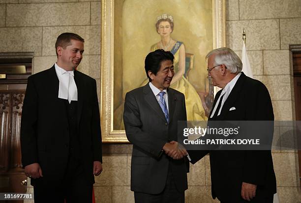 Prime Minister of Japan Shinzo Abe is greeted by Speaker of the Senate Noel Kinsella and Speaker of the House of Commons Andrew Scheer on Parliament...