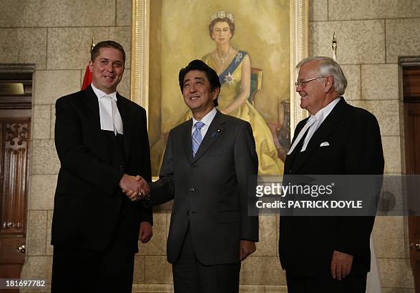 Prime Minister of Japan Shinzo Abe is greeted by Speaker of the House of Commons Andrew Scheer and Speaker of the Senate Noel Kinsella on Parliament...
