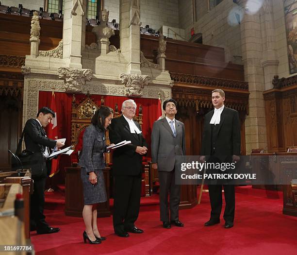 Prime Minister of Japan Shinzo Abe stands with Speaker of the House of Commons Andrew Scheer and Speaker of the Senate Noel Kinsella during a tour of...