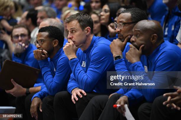 Associate head coach Jai Lucas, head coach Jon Scheyer and associate head coach coach Chris Carrawell watch the team play during the game against the...