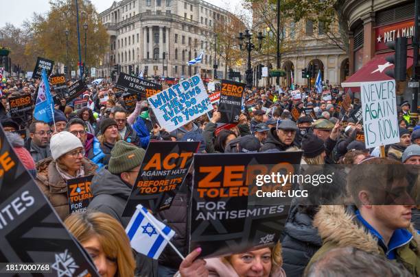 London, UK, November 26 2023, Pro-Israeli protesters at the "March Against Antisemitism" hold flags and placards in support of hostages taken by...