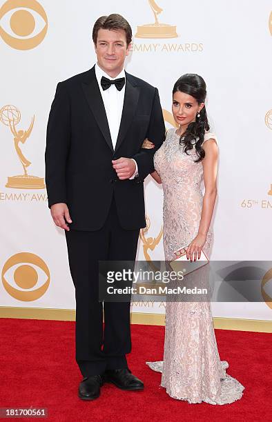 Nathan Fillion and Mikaela Hoover arrive at the 65th Annual Primetime Emmy Awards at Nokia Theatre L.A. Live on September 22, 2013 in Los Angeles,...