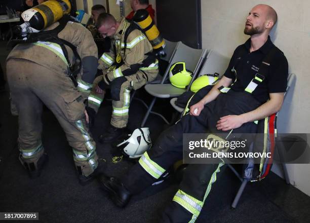 Firefighter rests after taking part in the "Zagreb Firefighter Stair Challenge", a charity event for humanitarian non-profit association "The...