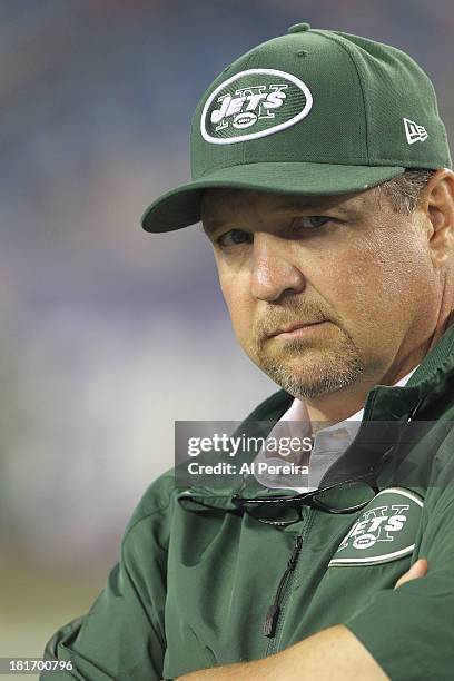 Offensive Coordinator Marty Mornhinweg of the New York Jets follows a play against the New England Patriots on a rainy night at Gillette Stadium on...