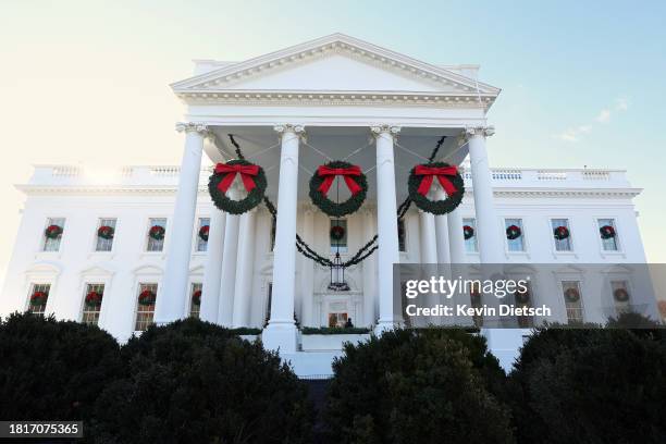 The North Portico is decorated with holiday wreaths during a media preview of the holiday decorations at the White House November 27, 2023 in...