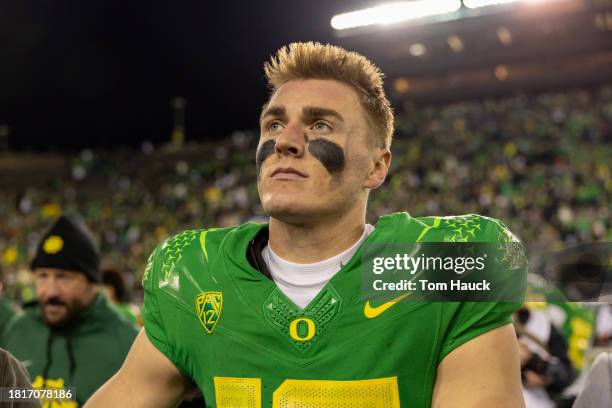 Quarterback Bo Nix of the Oregon Ducks celebrates after defeating the Oregon State Beavers 31-7 at Autzen Stadium on November 24, 2023 in Eugene,...