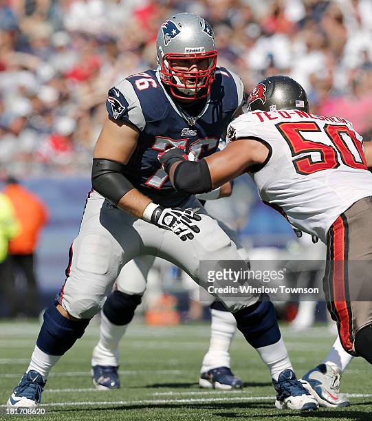 Sebastian Vollmer of the New England Patriots prepares to block Daniel Te'o-Nesheim of the Tampa Bay Buccaneers during the second half at Gillette...