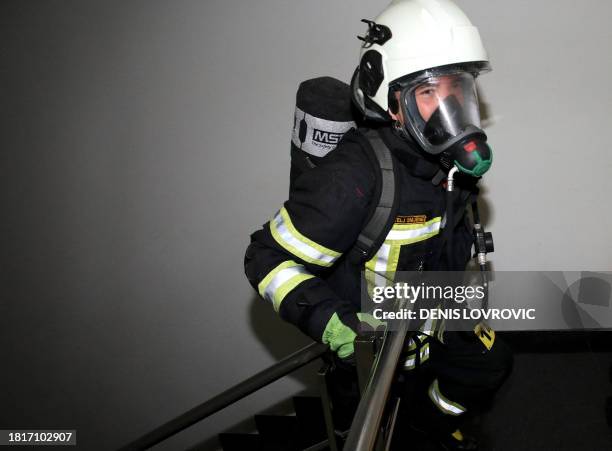 Firefighter takes take part in the "Zagreb Firefighter Stair Challenge", a charity event for humanitarian non-profit association "The Hummingbirds"...