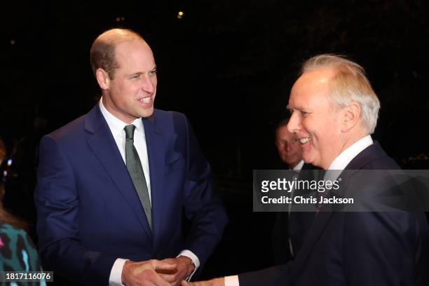 Founder and CEO of Tusk Trust Charlie Mayhew OBE greets Prince William, Prince of Wales as he arrives at the 2023 Tusk Conservation Awards at The...