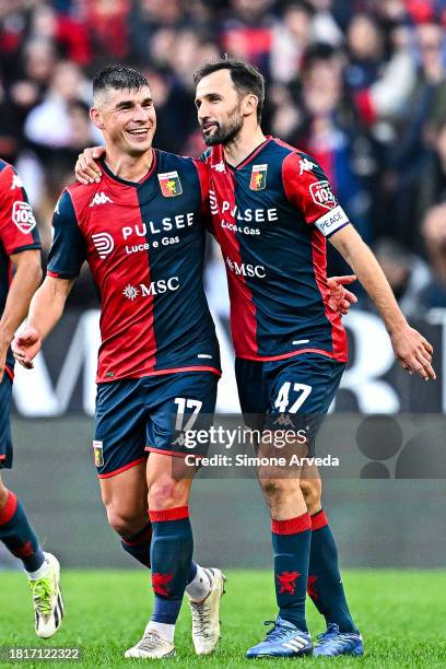 Ruslan Malinovskyi of Genoa celebrates with his team-mate Milan Badelj after scoring a goal during the Serie A TIM match between Genoa CFC and Empoli...