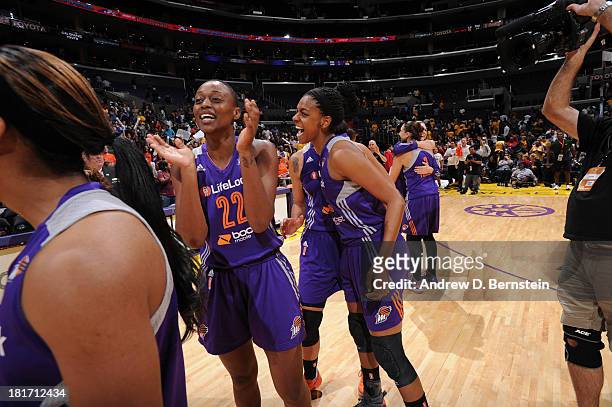 September 23: Charde Houston of the Phoenix Mercury and her teammate celebrate their victory over the Los Angeles Sparks in Game Three of the Western...