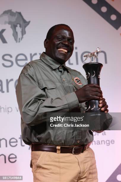 Jealous Mpofu receives the Wildlife Ranger Award with Peter Blinston of Painted Dog Conservation in Zimbabwe onstage during the 2023 Tusk...
