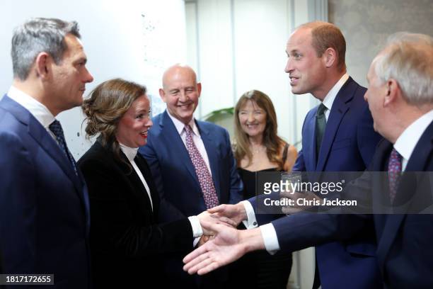Founder and CEO of Tusk Trust Charlie Mayhew OBE greets Prince William, Prince of Wales as he arrives at the 2023 Tusk Conservation Awards at The...