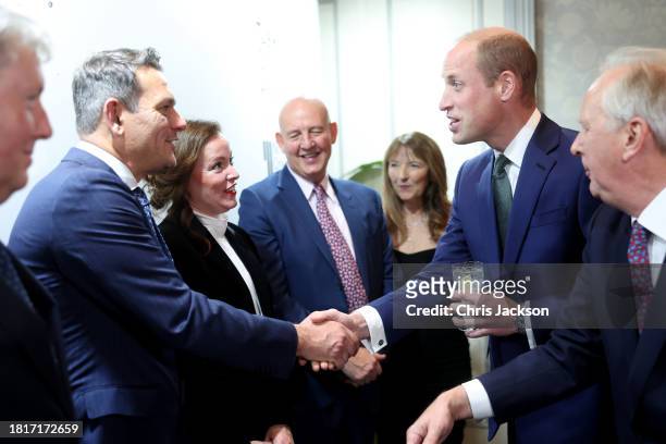 Prince William, Prince of Wales greets Managing Director at Jaguar Land Rover Mark Cameron, Managing Director, Defender, JLR - Global Purpose...