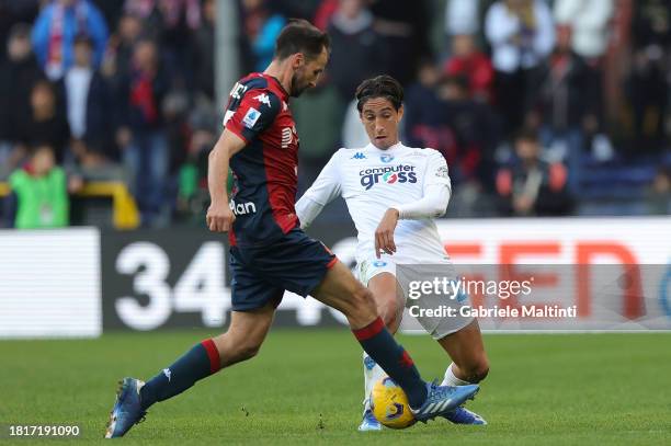 Youssef Maleh of Empoli FC battles for the ball with Milan Badelj of Genoa CFC during the Serie A TIM match between Genoa CFC and Empoli FC at Stadio...