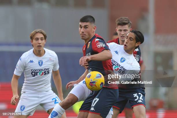 Youssef Maleh of Empoli FC battles for the ball with Ruslan Malinoskyi of Genoa CFC during the Serie A TIM match between Genoa CFC and Empoli FC at...