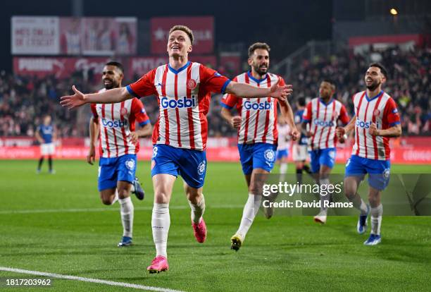 Viktor Tsyhankov of Girona FC celebrates after scoring the team's first goal with teammates during the LaLiga EA Sports match between Girona FC and...