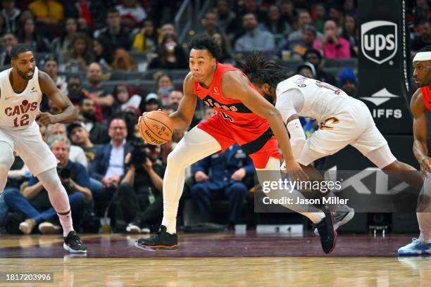 Scottie Barnes of the Toronto Raptors brings the ball up court during the third quarter against the Cleveland Cavaliers at Rocket Mortgage Fieldhouse...