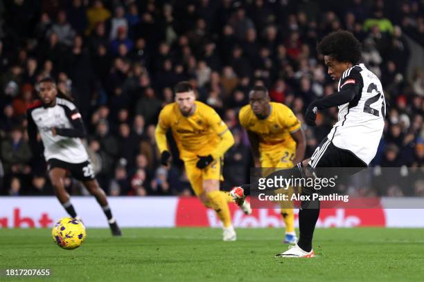 Willian of Fulham scores the team's second goal from a penalty kick during the Premier League match between Fulham FC and Wolverhampton Wanderers at...