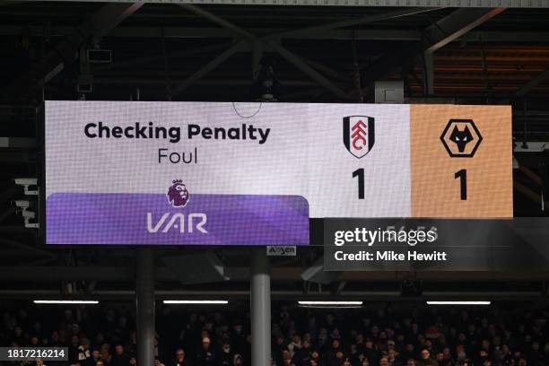 The LED board shows the message "Checking Penalty Foul VAR" as a VAR Review takes place, after Tom Cairney of Fulham is fouled by Mario Lemina of...