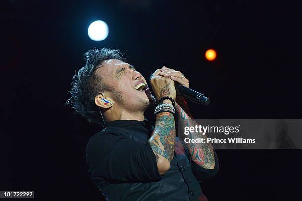 Arnel Pineda of Journey performs during Music Midtown 2013 - Day 1 at Piedmont Park on September 20, 2013 in Atlanta, Georgia.