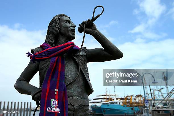 Statue of former ACDC lead singer Bon Scott is pictured wearing a Dockers scarf at Fishing Boat Harbour on September 24, 2013 in Fremantle,...