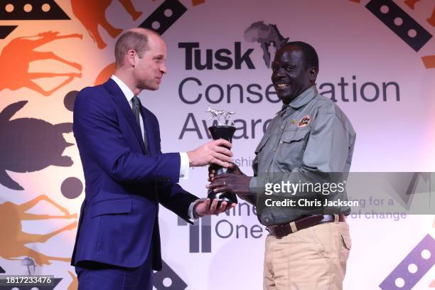 Prince William, Prince of Wales presents the Wildlife Ranger award onstage to Jealous Mpofu during the 2023 Tusk Conservation Awards at The Savoy...