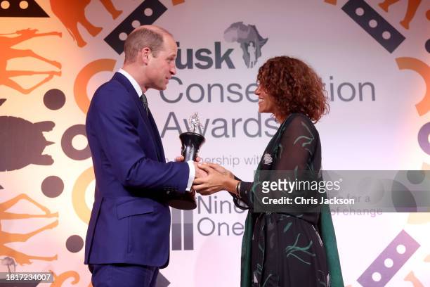 Prince William, Prince of Wales presents the Tusk Award award onstage to Fanny Minesi during the 2023 Tusk Conservation Awards at The Savoy Hotel on...