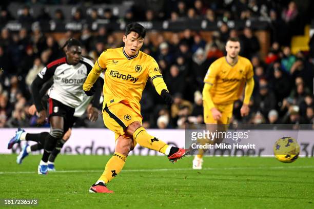 Hwang Hee-Chan of Wolverhampton Wanderers scores the team's second goal from a penalty kick during the Premier League match between Fulham FC and...