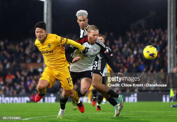 Tim Ream of Fulham FC fouls Hee Chan Hwang of Wolverhampton Wanderers resulting in a penalty for Wolverhampton Wanderers during the Premier League...