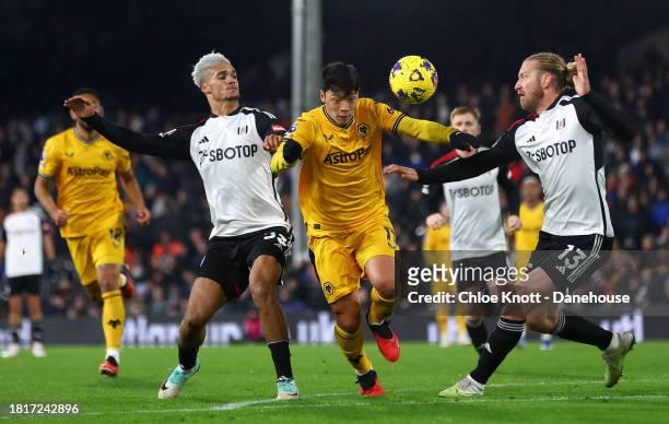 Tim Ream of Fulham FC fouls Hee Chan Hwang of Wolverhampton Wanderers resulting in a penalty for Wolverhampton Wanderers during the Premier League...