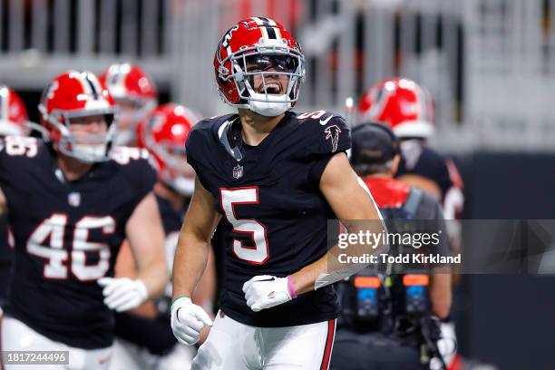 Drake London of the Atlanta Falcons reacts after a Falcons touchdown during the second quarter against the New Orleans Saints at Mercedes-Benz...