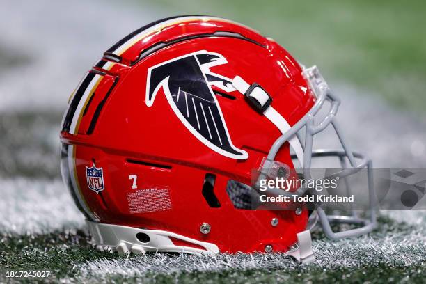 An Atlanta Falcons throwback helmet rests on the field prior to the game between the New Orleans Saints and Atlanta Falcons at Mercedes-Benz Stadium...