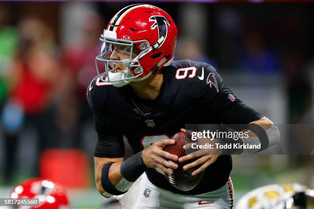 Desmond Ridder of the Atlanta Falcons scrambles during the second quarter against the New Orleans Saints at Mercedes-Benz Stadium on November 26,...