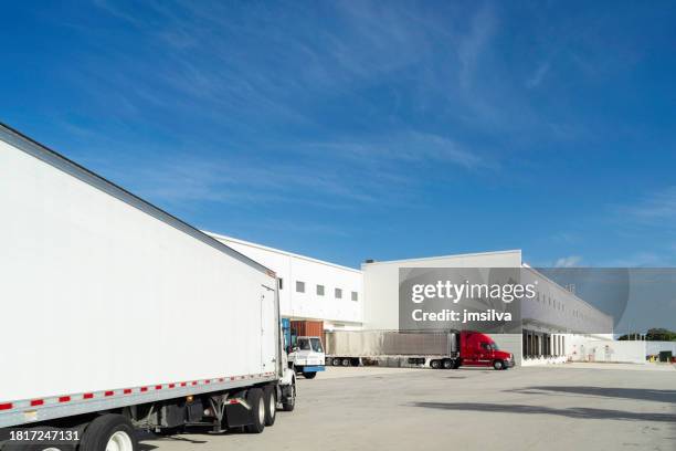 truck entering a loading dock of a warehouse. - loading dock stock pictures, royalty-free photos & images