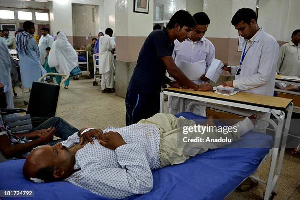 Pakistani Christians wounded in the twin suicide attacks on All Saints Church in Peshawar receive treatment at Lady Reading Hospital on September 23,...