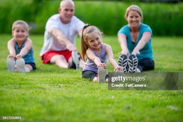 family fitness - dad press ups kids stock pictures, royalty-free photos & images