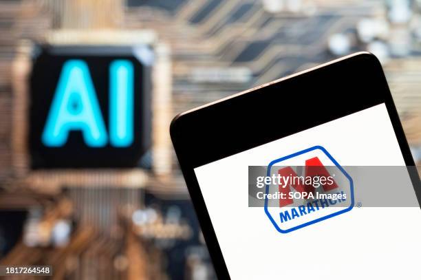 In this photo illustration, the American petroleum and natural gas exploration and production company Marathon logo seen displayed on a smartphone...