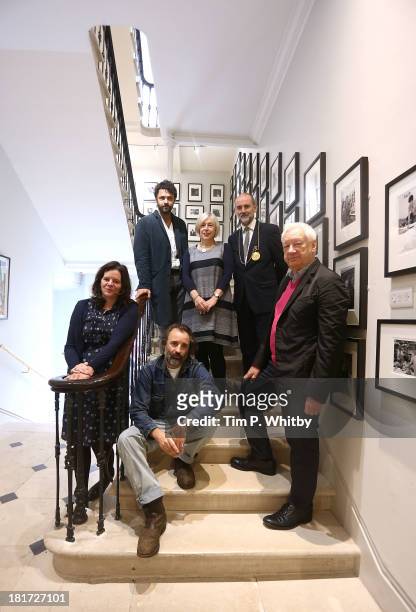 Royal Academicians Chantal Joffe, Conrad Shawcross, Eileen Cooper, Christopher Le Brun, Michael Craig Martin and Mike Nelson pose for a photograph...