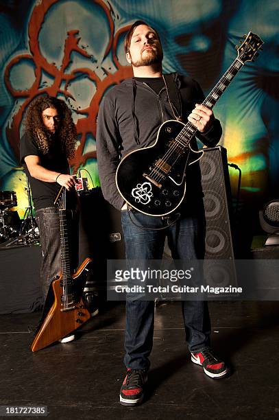 Claudio Sanchez and Travis Stever of American progressive rock band Coheed and Cambria photographed during a portrait shoot for Total Guitar...