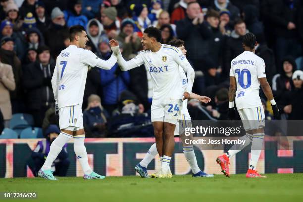 Joel Piroe of Leeds United celebrates with teammates Dan James , Georginio Rutter and Crysencio Summerville after scoring the team's third goal from...