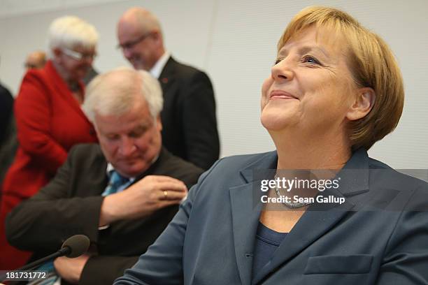German Chancellor and Chairwoman of the German Christian Democrats Angela Merkel smiles as Horst Seehofer, Chairman of the Bavarian Christian...