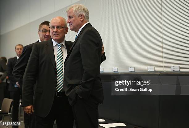 Volker Kauder, head of the Bundestag faction of the German Christian Democrats chats with Horst Seehofer, Chairman of the Bavarian Christian...