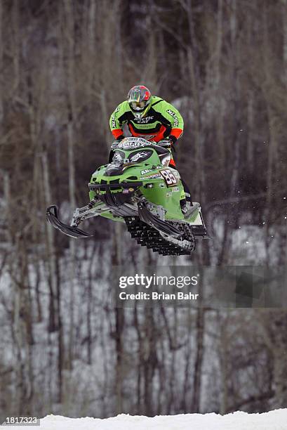 Tucker Hibbert of the USA flies through the air during the Snowmobile SnoCross competition of the Winter X Games VII at Buttermilk Mountain on...