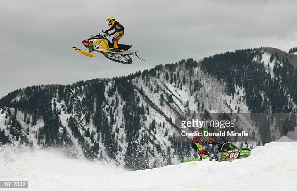 Steven Taylor of Canada gets some big air over Tucker Hibbert of USA Snowmobile SnoCross Event during the Winter X-Games VII at Buttermilk Mountain...