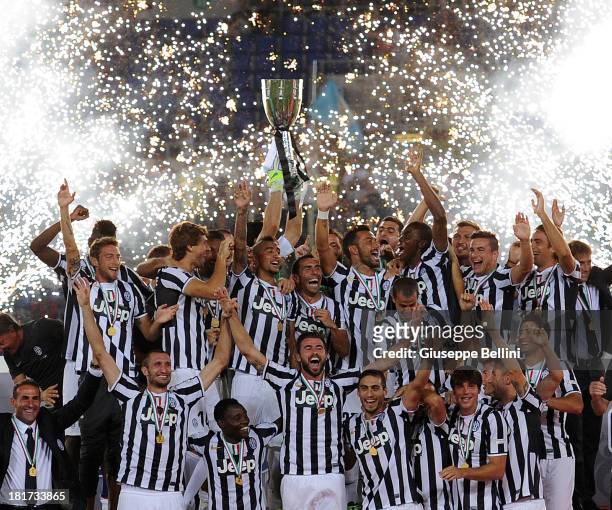 The players of Juventus celebrate the victory after the TIM Supercup match between SS Lazio and FC Juventus at Olimpico Stadium on August 18, 2013 in...